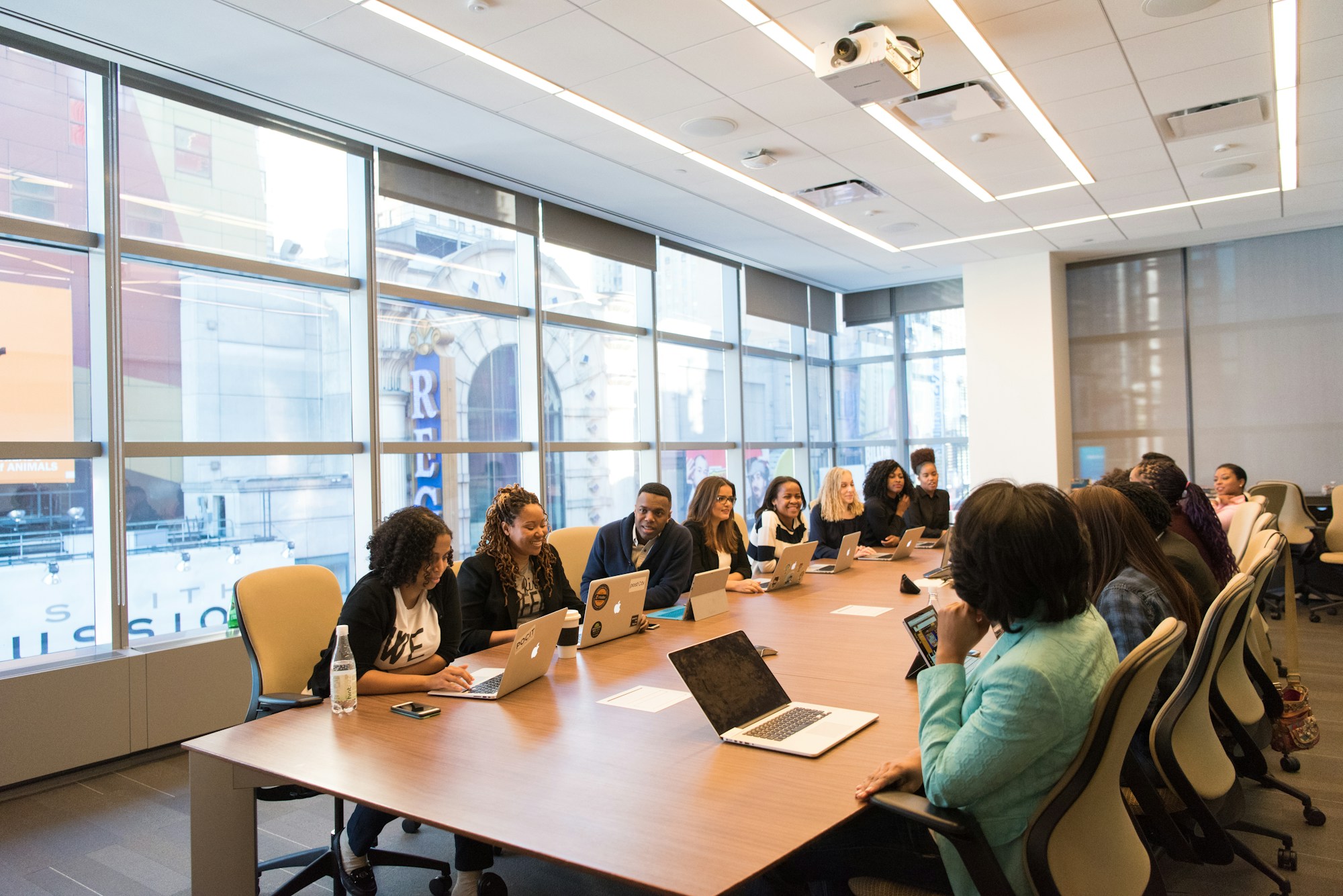 A project team collaborating around a table in a bright modern office