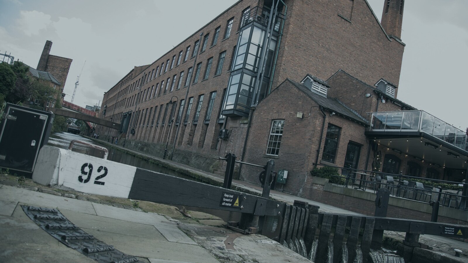 Restored industrial buildings beside a canal in Manchester.