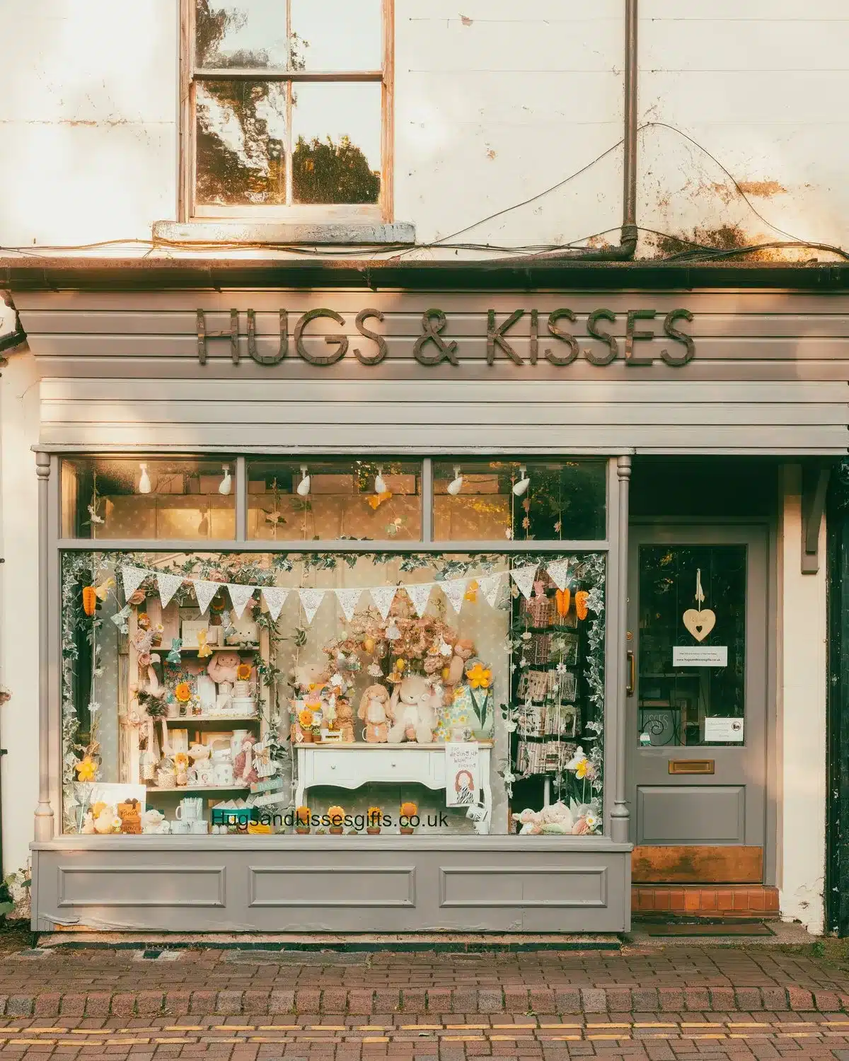 The painted shopfront of Hugs and Kisses, a gift shop in England