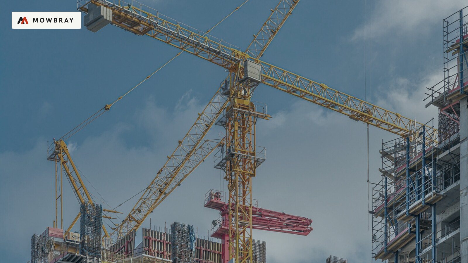 Tower cranes over a city construction site