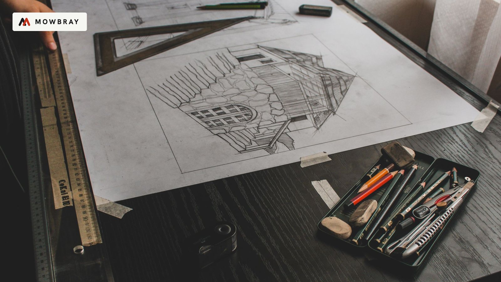 An unfinished pencil drawing of a building on a drafting table